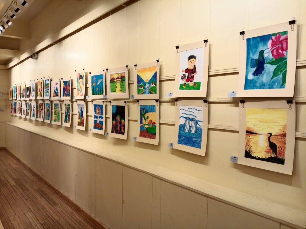 A wall of creativity—student artworks proudly displayed for public viewing.